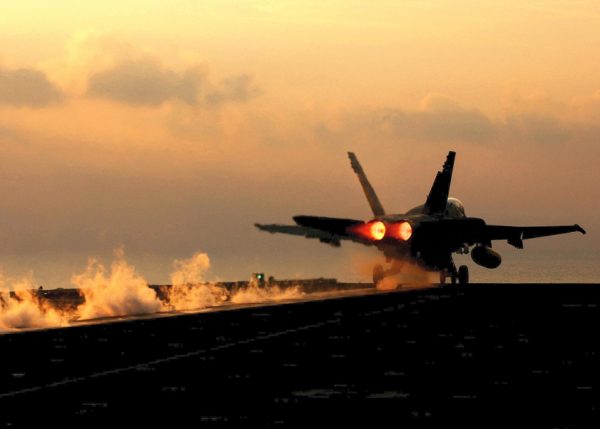 F/A-18 Hornet Jet Taking Off at Sunset – U.S. Navy Aircraft Carrier Operations, Military Fighter Jet at Dusk, Aviation Photography